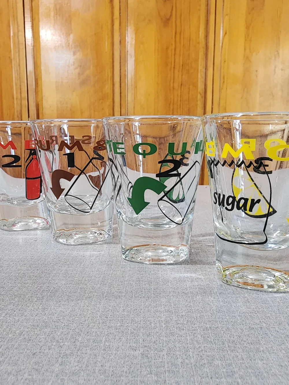 Clear Glass Shot Glasses with Multicolor Icons - Set of 4